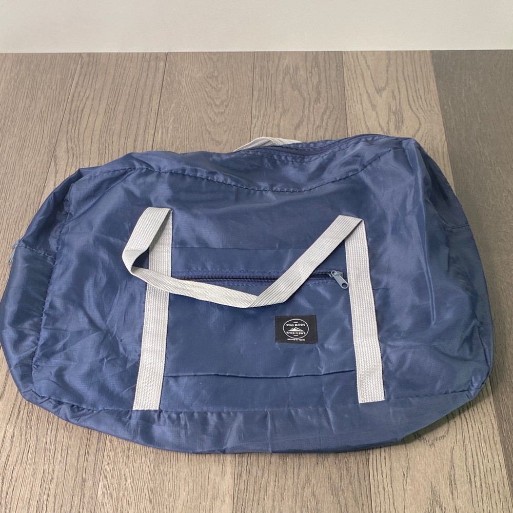 Gray and Blue Duffel Bag with Practical Design